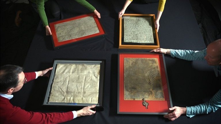 The four surviving exemplars of the 1215 Magna Carta, brought together at the British Library in 2015: the charter nine direct ancestors were appointed to enforce. Image: PA, BBC