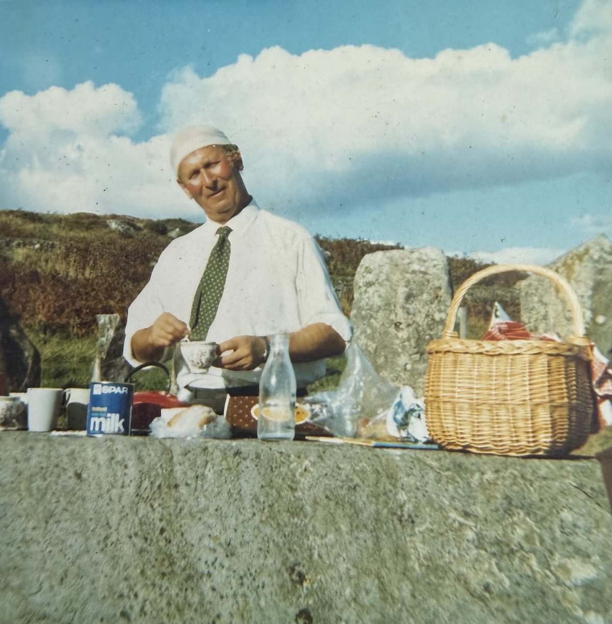 Herbert Jones taking afternoon tea at the Drombeg stone circle, September 1970